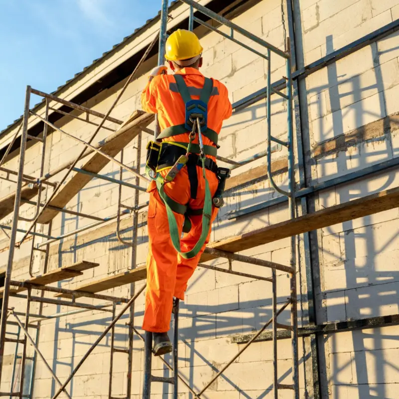 Worker using fall protection during construction work